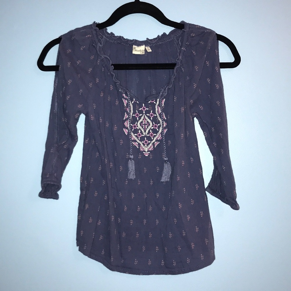 blue blouse with patterns and open shoulder